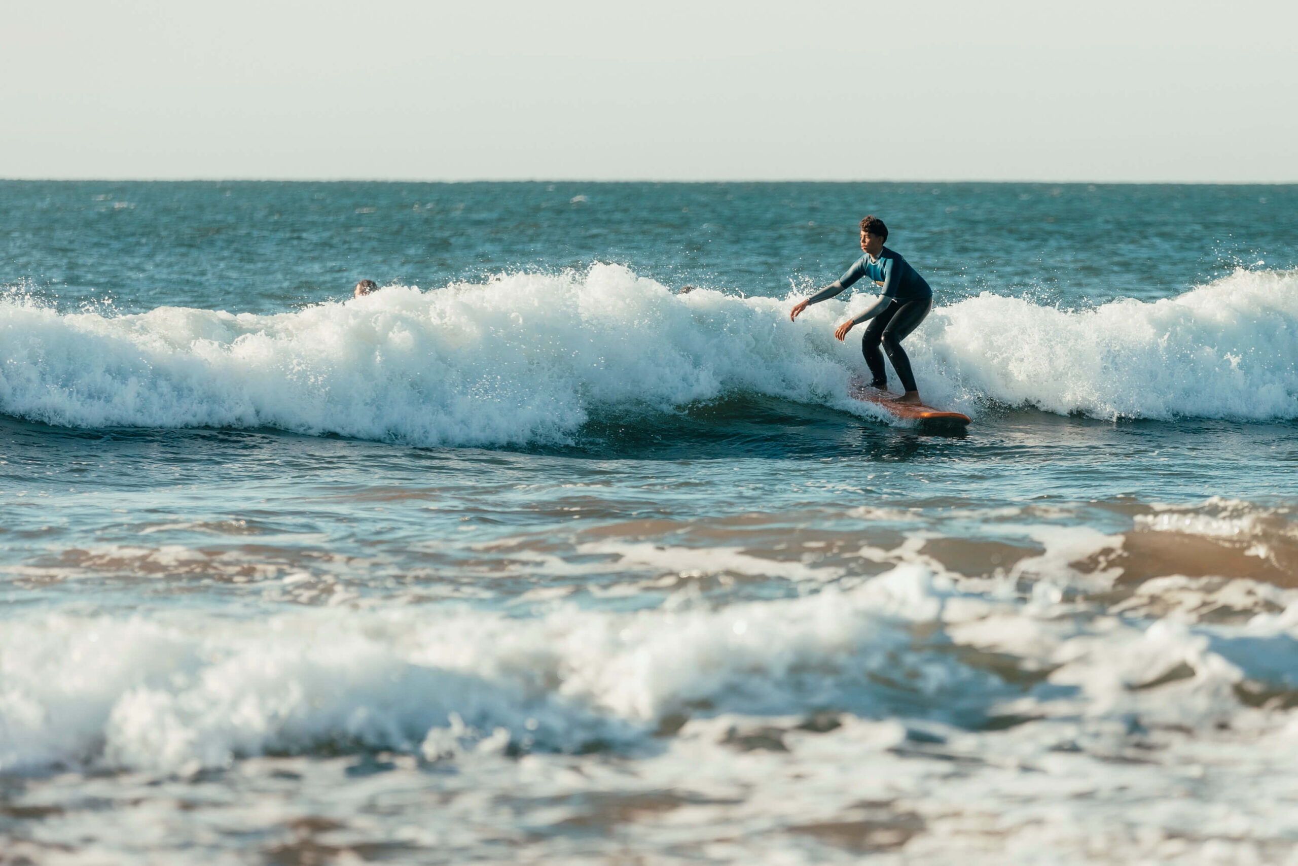 Surf camp lisbon - Surfer in the wave